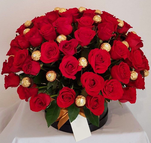 Roses and chocolates in basket, flower delivery in muscat